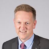 Headshot of a man in a suit