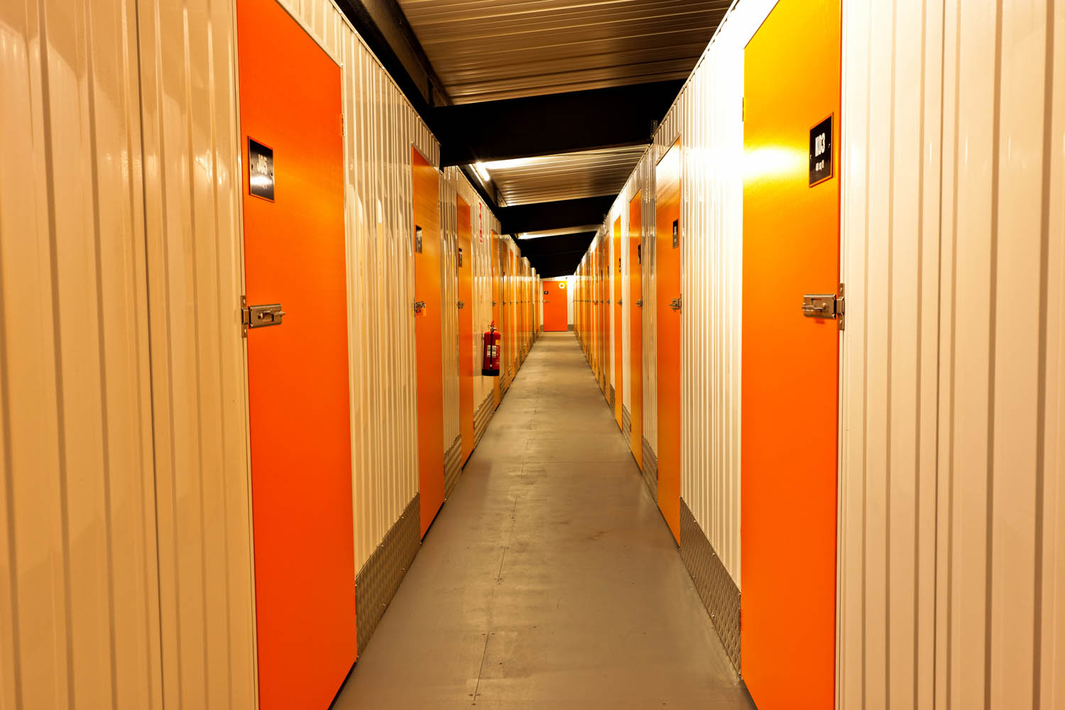 Bright orange OrangeBox self-storage corridor